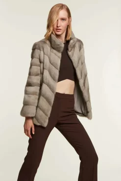 Mink jacket with textile inserts