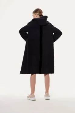 Reversible hooded sheepskin coat